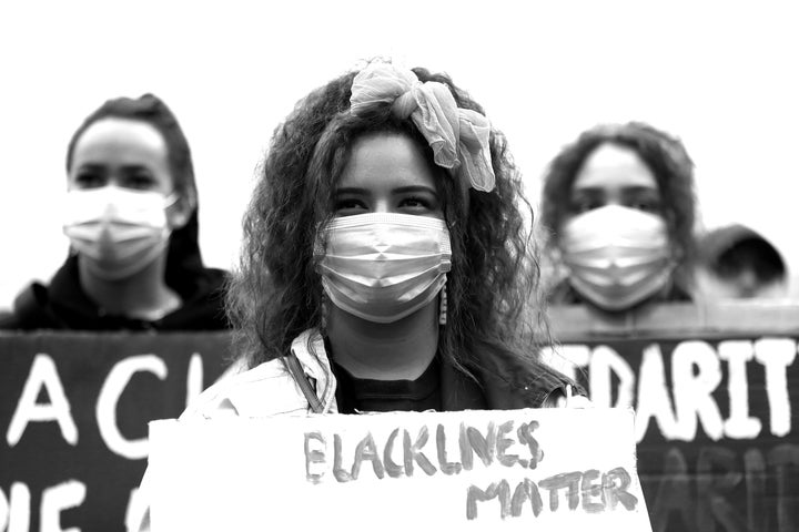 AUCKLAND, NEW ZEALAND - JUNE 01: (This image has been converted to black and white.) Protestors march down Queen Street on June 01, 2020 in Auckland, New Zealand. The rally was organised in solidarity with protests across the United States following the killing of an unarmed black man George Floyd at the hands of a police officer in Minneapolis, Minnesota. (Photo by Hannah Peters/Getty Images)