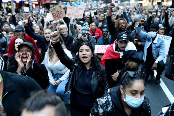 AUCKLAND, NEW ZEALAND - JUNE 01: Protestors march down Queen Street on June 01, 2020 in Auckland, New Zealand. The rally was organised in solidarity with protests across the United States following the killing of an unarmed black man George Floyd at the hands of a police officer in Minneapolis, Minnesota. (Photo by Hannah Peters/Getty Images)