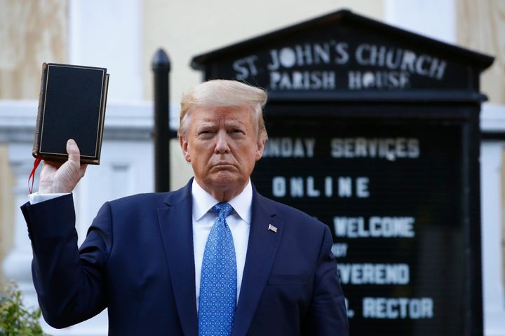 Donald Trump holds a Bible as he visits outside St. John's Church across Lafayette Park from the White House.