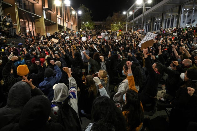 Protesters shout slogans and hold up placards during a rally for justice in Sydney on June 2, 2020, against the deaths of members of the Aboriginal community in Australia and the death of George Floyd.