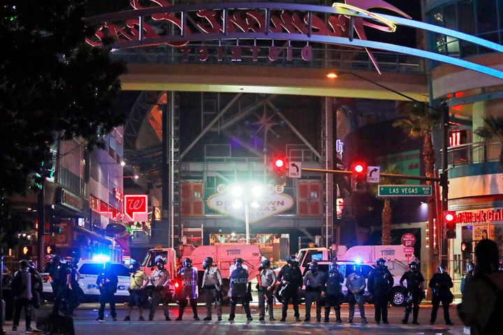 Police stand in formation at the entrance to Fremont Street Experience on June 1, 2020, in downtown Las Vegas. 