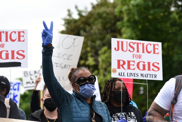 A family member of Regis Korchinski-Paquet attends an anti-racism rally in Toronto on May 30, 2020. Ontario's Special Investigations Unit is investigating the 29-year-old's balcony fall death after her family questioned the role of police officers.