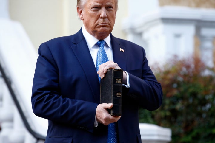 President Donald Trump holds a Bible outside St. John's Church in Washington, D.C., on Monday night. Faith leaders say they were among those who were tear-gassed by federal police clearing the area for the photo-op.