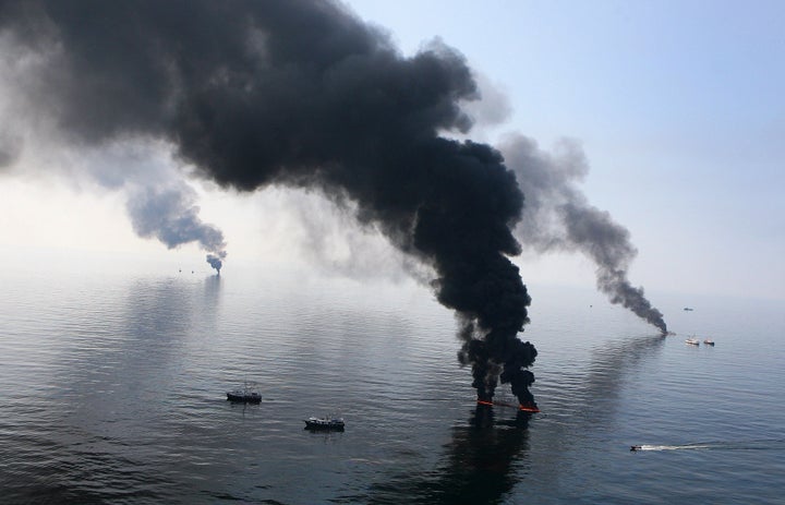 Smoke billows from a controlled burn of spilled oil off the Louisiana coast after the April 2010 Deepwater Horizon explosion killed 11 workers and ruptured BP's deep-sea well. 