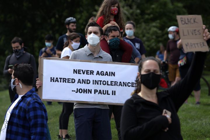 Demonstrators stage a protest near the Saint John Paul II National Shrine, which President Donald Trump visited on June 2 in Washington, D.C.