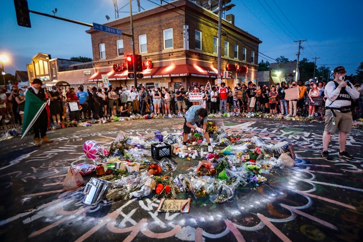 Protesters gather at a memorial for George Floyd where he died after being restrained by Minneapolis police officers on May 2