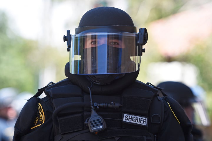 A Contra Costa County Sheriff deputy dressed in riot gear stands on Lincoln Ave. while on patrol in Walnut Creek, Calif., on June 1, 2020.