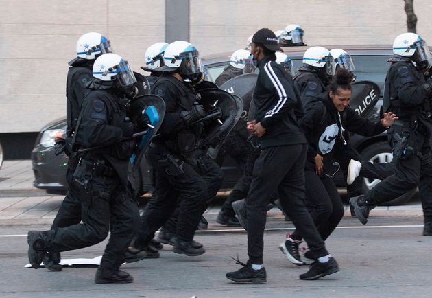 Police push back protesters during a demonstration on May 31, 2020 calling for justice in the death of...