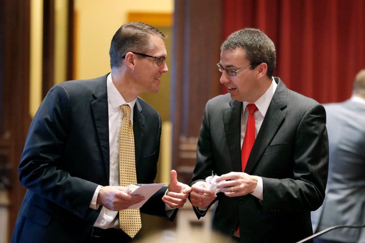 Sen. Randy Feenstra, left, talks with state Sen. Roby Smith in the Iowa Legislature in 2019. Feenstra will face Democrat J.D. Scholten in November for Congress.