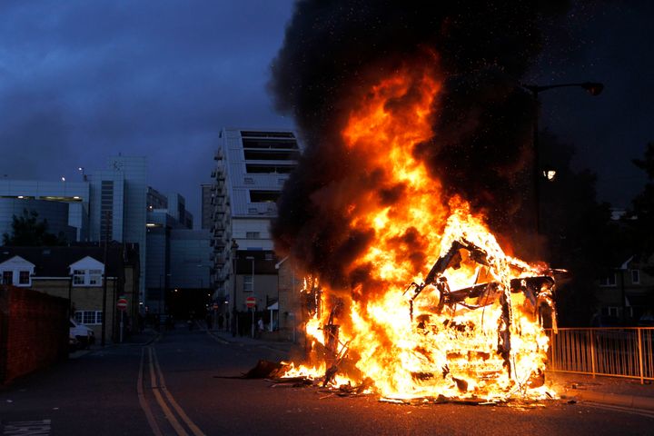 A bus is set on fire as rioters gathered in Croydon, south London, on August 8 2011.