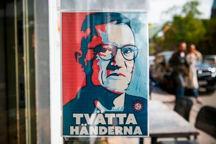 A sign with a portrait of Anders Tegnell, the face of the country's response to the novel coronavirus COVID-19 pandemic, is hanged at an entrance to a restaurant to instruct people to wash their hands on May 10.