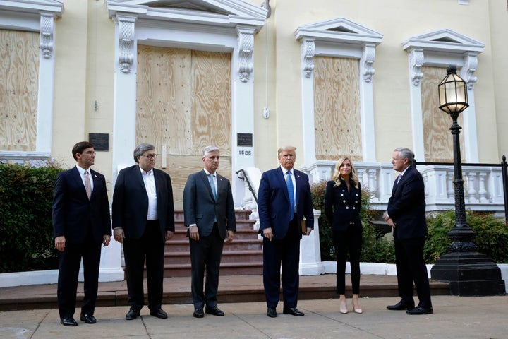 President Donald Trump stands outside St. John's Church across Lafayette Park by the White House on Monday, June 1, in Washington, D.C. Part of the church was set on fire during protests Sunday night. Standing with Trump are Defense Secretary Mark Esper, from left, Attorney General William Barr, White House national security adviser Robert O'Brien, White House press secretary Kayleigh McEnany and White House chief of staff Mark Meadows. (AP Photo/Patrick Semansky)