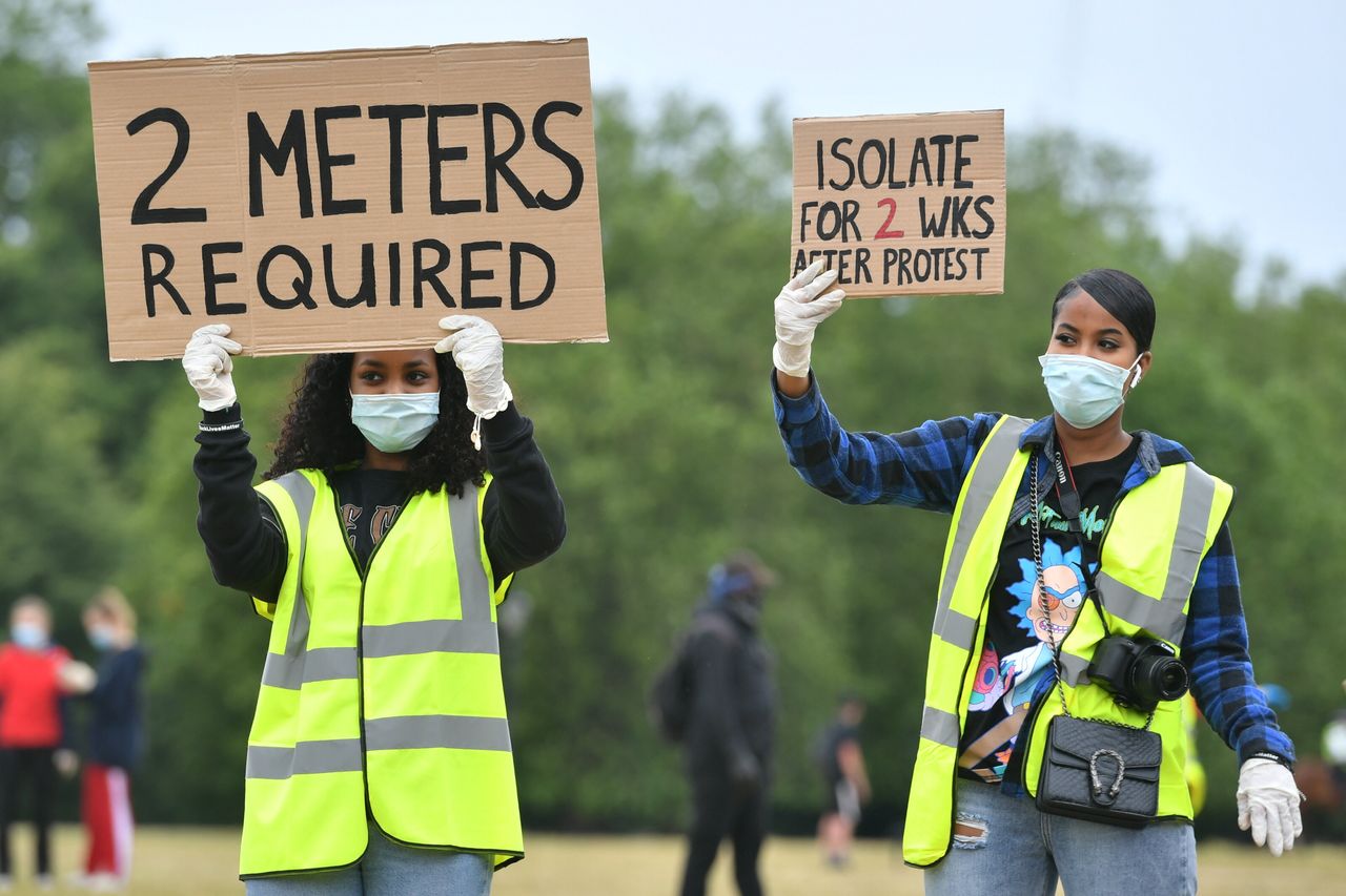 Stewards direct people as they begin to gather ahead of the Black Lives Matter protest rally in Hyde Park, London, in memory of George Floyd who was killed on May 25 while in police custody in the US city of Minneapolis.