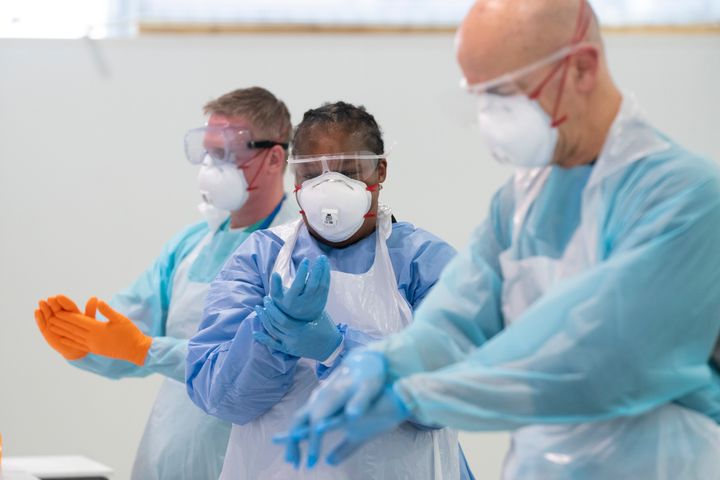 Staff in Manchester's Nightingale Hospital, pictured in April, are trained in putting on PPE