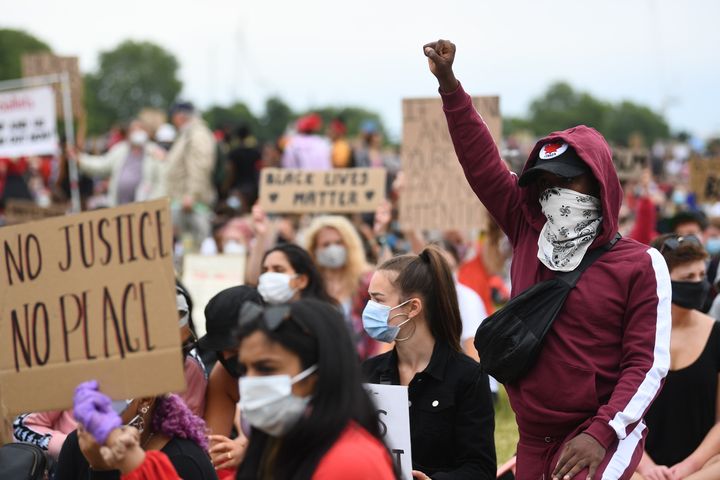 People participate in a Black Lives Matter protest rally in Hyde Park, London, in memory of George Floyd who was killed on May 25 while in police custody in the US city of Minneapolis.
