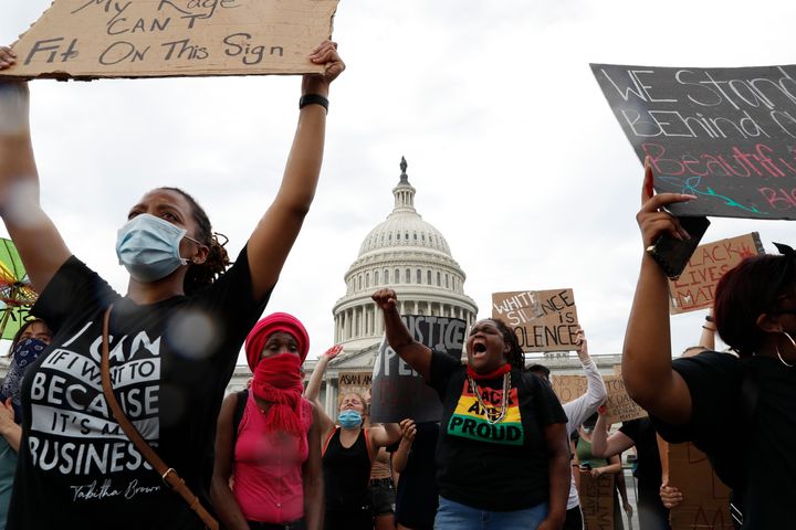 Dominique Bryant, 23, wearing the "Black and Proud" T-shirt, joins others protesting the death of Floyd on June 3 outside the U.S. Capitol in Washington.