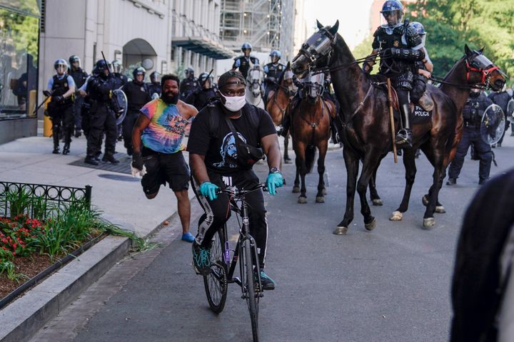 Police begin moving demonstrators who had gathered to protest the death of George Floyd, from the streets near the White House in Washington on June 1.