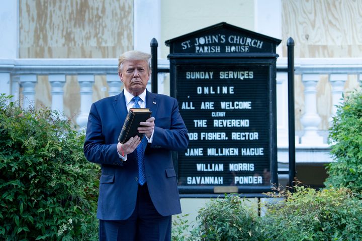 President Donald Trump holds a Bible while visiting St. John's Church on Monday.