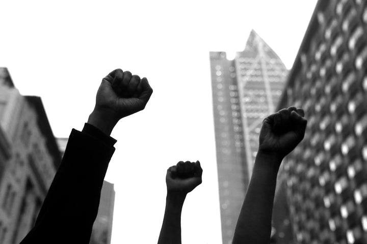 Protestors march down Queen Street on June 01, 2020 in Auckland, New Zealand. (Photo by Hannah Peters/Getty Images)