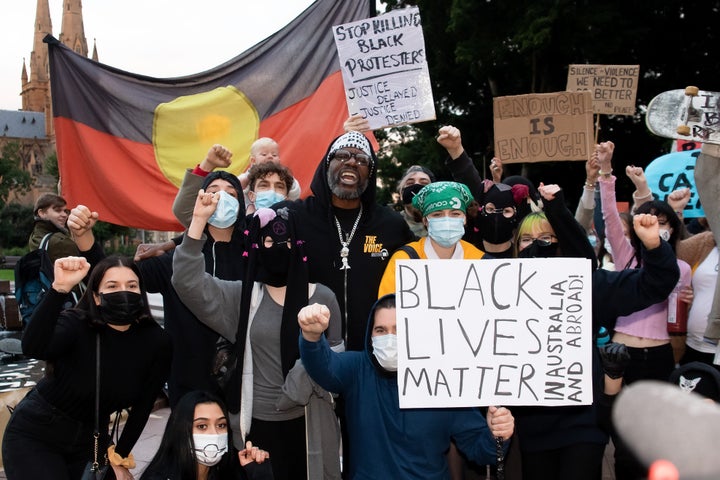 SYDNEY, AUSTRALIA - JUNE 02: Protesters shout slogans and hold up signs in Hyde Park during a 'Black Lives Matter' rally on 02 June, 2020 in Sydney, Australia. This event was organized to rally against aboriginal deaths in custody in Australia as well as in unity with protests across the United States following the killing of an unarmed black man George Floyd at the hands of a police officer in Minneapolis, Minnesota. (Photo by Speed Media/Icon Sportswire)