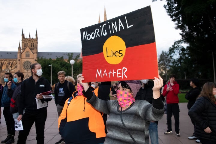 Protesters hold up signs in Hyde Park during a 'Black Lives Matter' rally on 02 June, 2020 in Sydney, Australia. (Photo by Speed Media/Icon Sportswire)