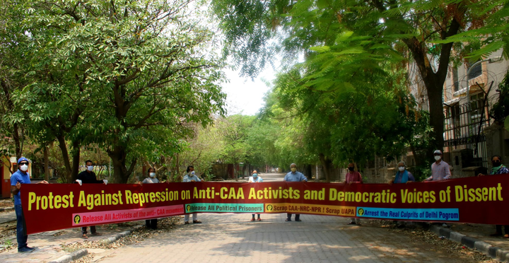 People protest against the arrest of anti-CAA activists in Delhi on Wednesday, June 3, 2020.