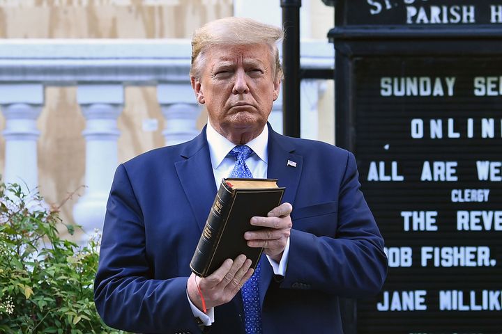 US President Donald Trump holds up a Bible outside of St John's Episcopal church in Washington, DC on June 1