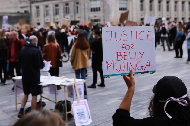 A protestor holds a sign for Belly Mujinga at a Black Lives Matter peaceful protest  in Southampton