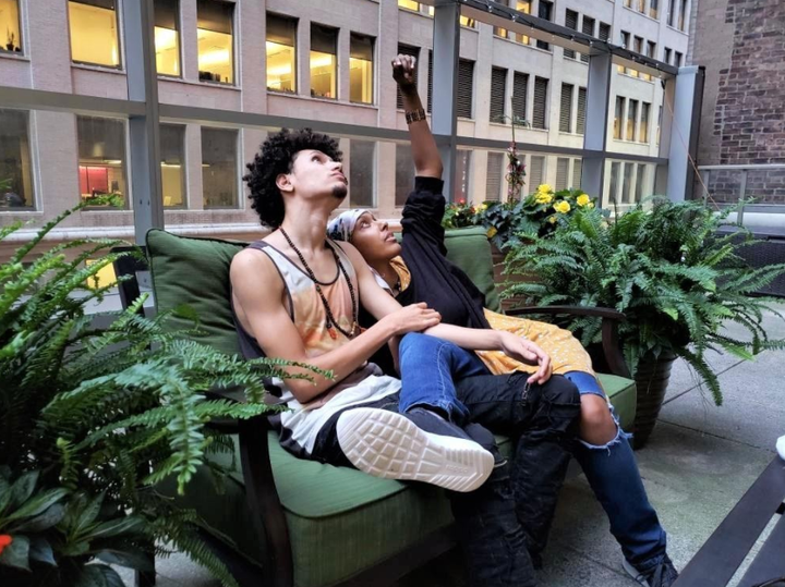 Gazes upward, always: the author, seated with a friend at the Hope Lodge in New York City, in 2018.