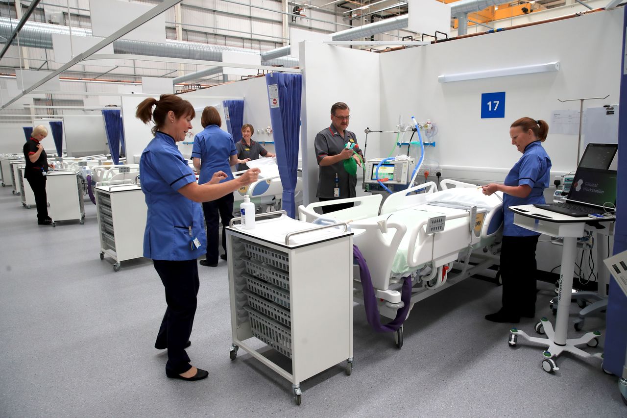 Staff prepare bays at the NHS Nightingale Hospital North East in Sunderland