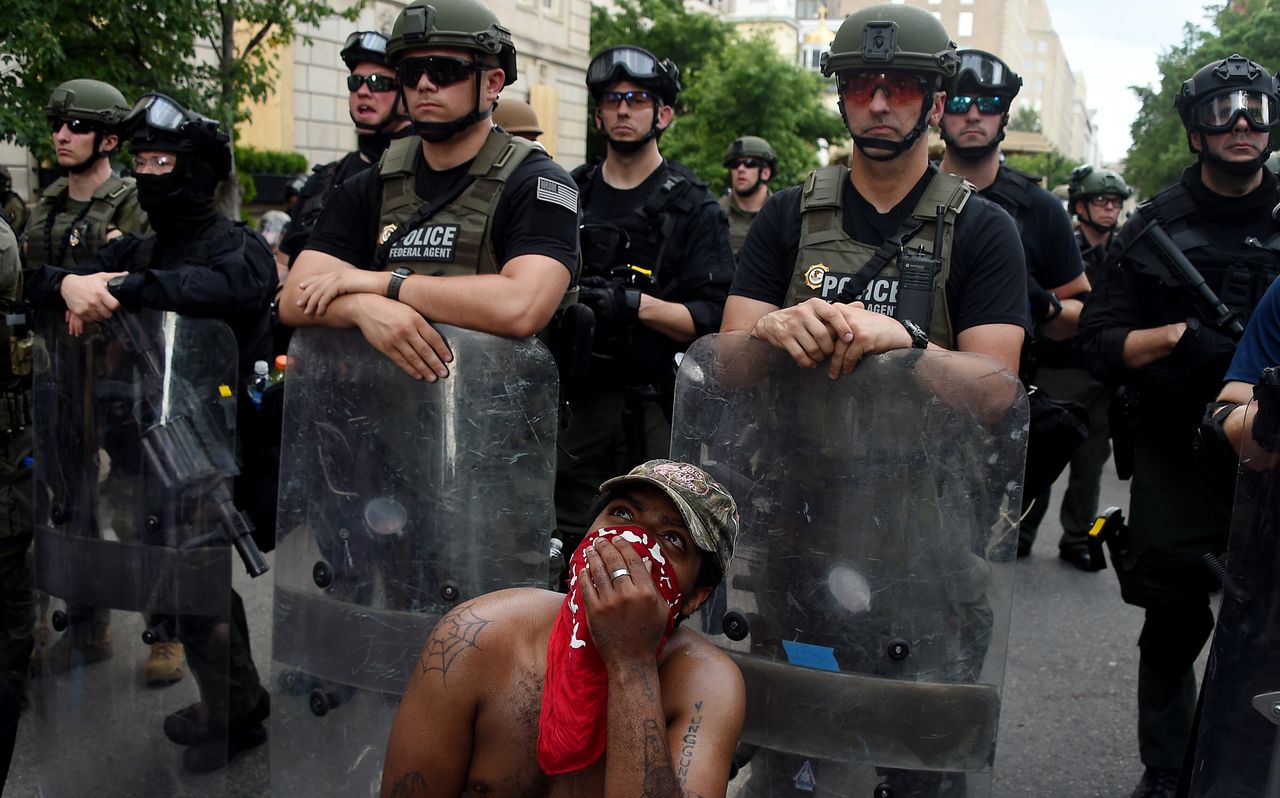 Protesters kneel in front of Lafayette Square near the White House on June 3 to protest the police killing of George Floyd.