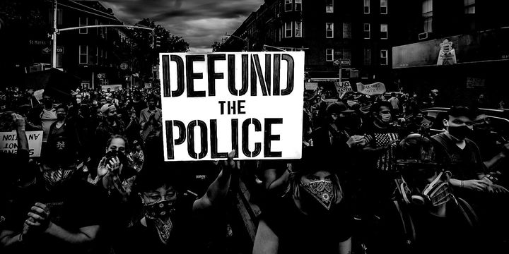 As demonstrations spotlighting racial injustice and police brutality continue, the chorus is growing to "defund" law enforcement agencies. This sign was held aloft in New York City.