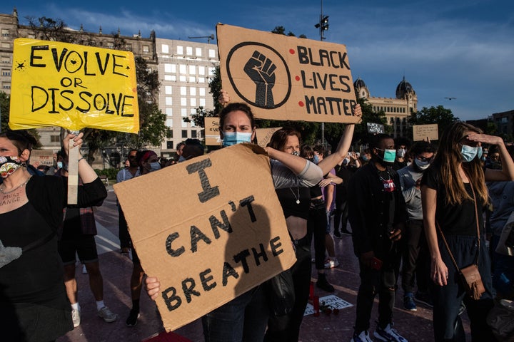 Demonstrators gather to mourn the death of George Floyd during a vigil at Catalunya Square on June 4, 2020 in Barcelona, Spain.