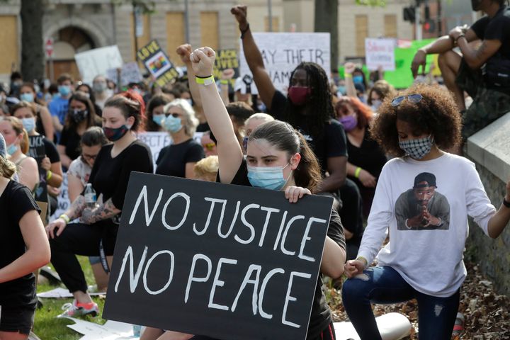 People attend a protest against police brutality on June 4, 2020, in Taunton, Mass.