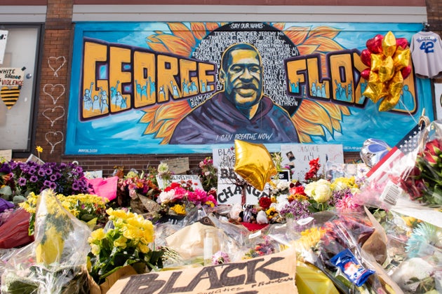 Community members gather in Minneapolis, where George Floyd was killed. The intersection served as a memorial and sacred space to honor Floyd.