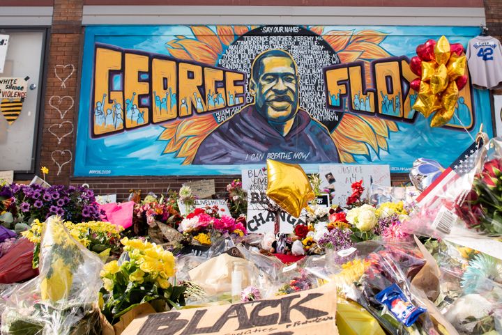 Community members gather in Minneapolis, where George Floyd was killed. The intersection served as a memorial and sacred space to honor Floyd.
