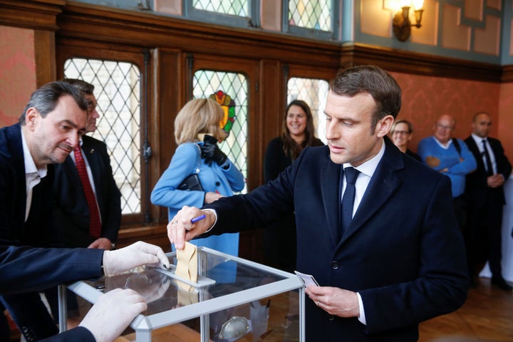 French President Emmanuel Macron casts his ballot during the first round of France's municipal elections on March 15, 2020.