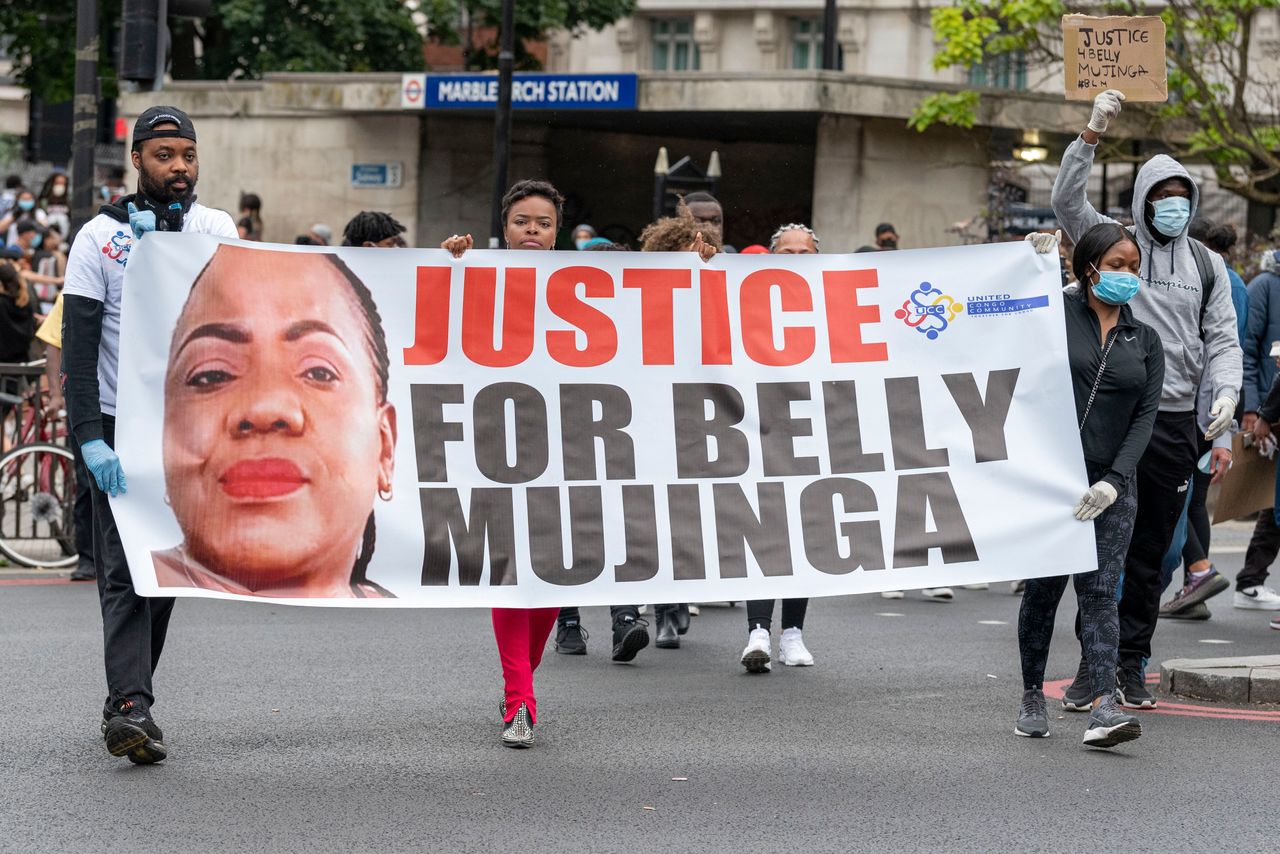 Protesters hold a banner reading 'Justice for Belly Mujinga' during a Black Lives Matter protest at Hyde Park on Wednesday