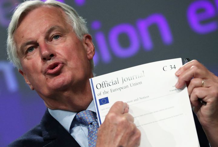EU chief Brexit negotiator Michel Barnier holds up the political declaration which he claims the UK is "backtracking" on