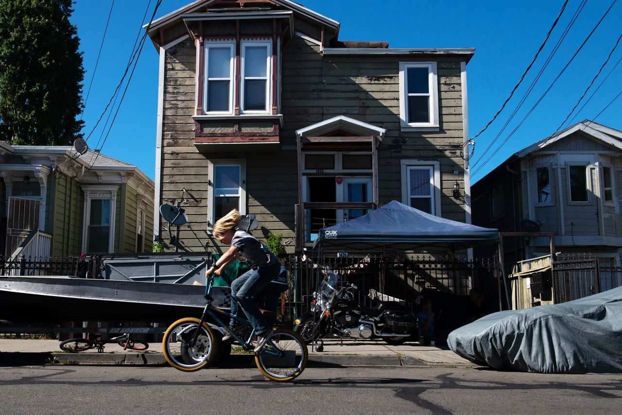 Gavin Armstrong, 12, rides his bike in West Oakland, California, near the busy Port of Oakland.