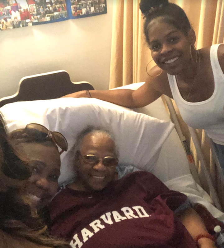 The author and her family visiting her great-grandmother (center) at her nursing home last summer. The author gave her great-grandmother a Harvard T-shirt before she started medical school.