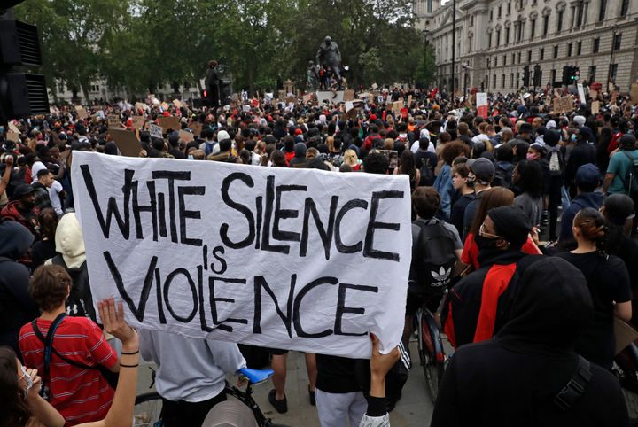 Protesters gather during a demonstration in Parliament Square in London 