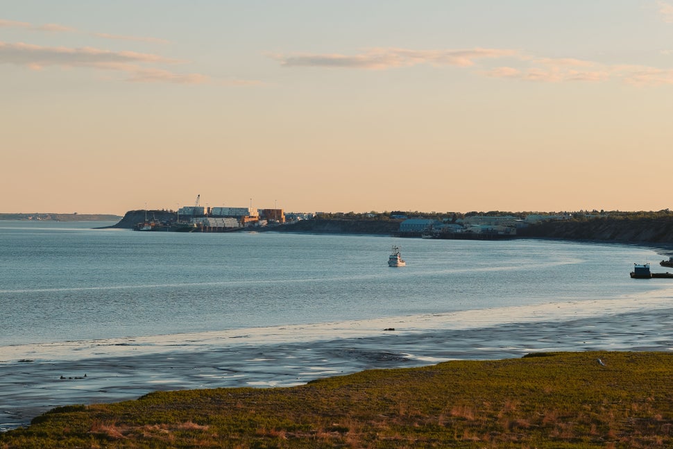 A Bristol Bay drift boat making a set during golden hour.