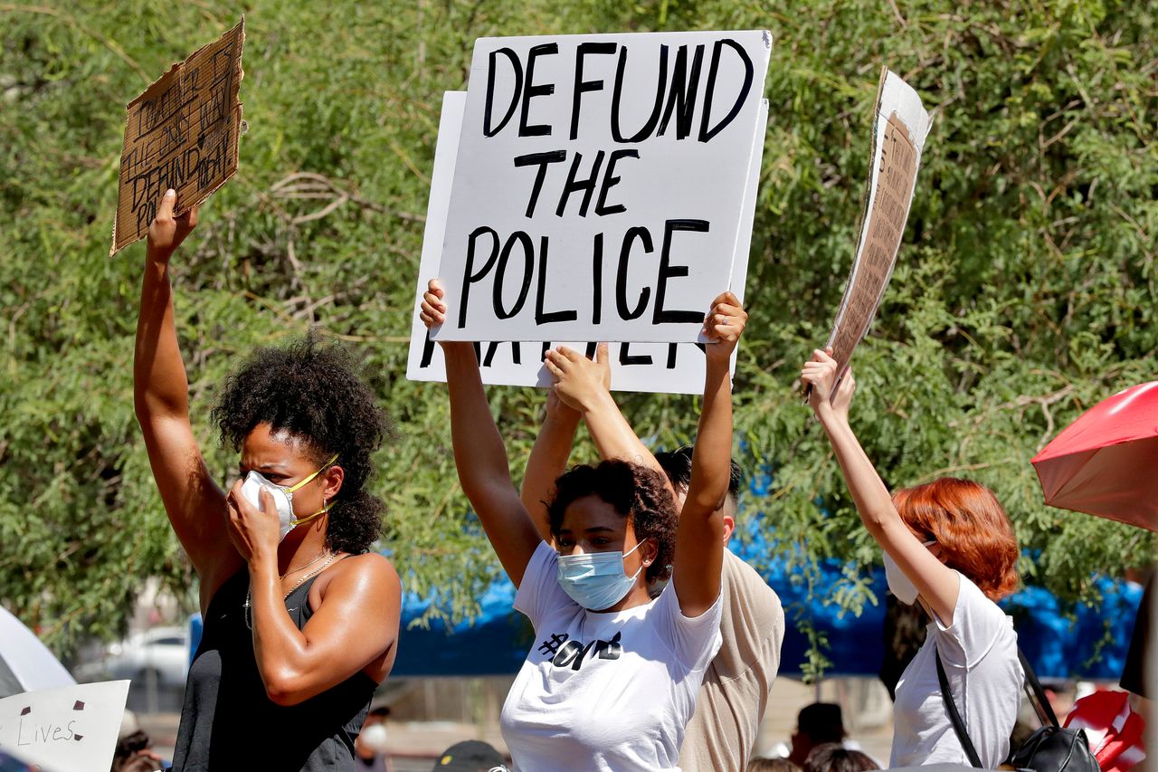 Protesters rally on June 3 in Phoenix demanding the city council defund the police department. The protest, like others nationwide, was sparked by the death of George Floyd, a Black man who was killed by Minneapolis police on May 25.