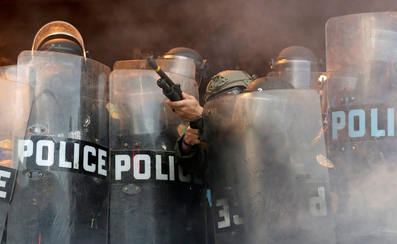 A police officer fires rubber bullets at protesters during a demonstration next to the city of Miami Police Department on May 30. Anti-racist protests were held throughout the country, sparked by the death of George Floyd, a Black man who was killed by Minneapolis police.