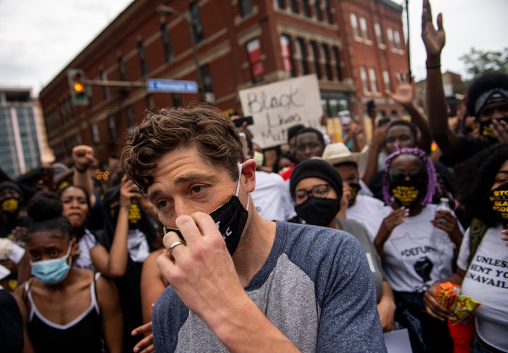 Minneapolis Mayor Jacob Frey leaves after declining to say he would fully defund the police at a protest on Saturday.