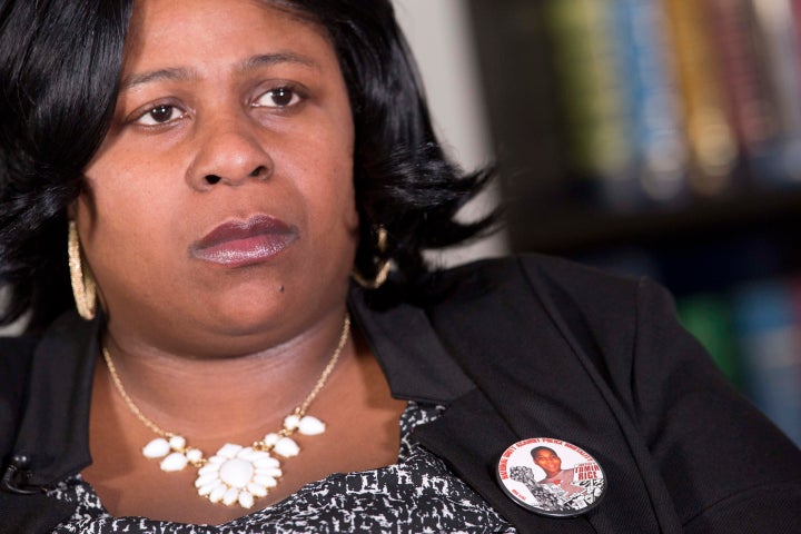 Samaria Rice wears a button with her son Tamir's photograph.