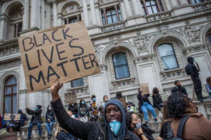 A protester holds a BLM placard during London protests