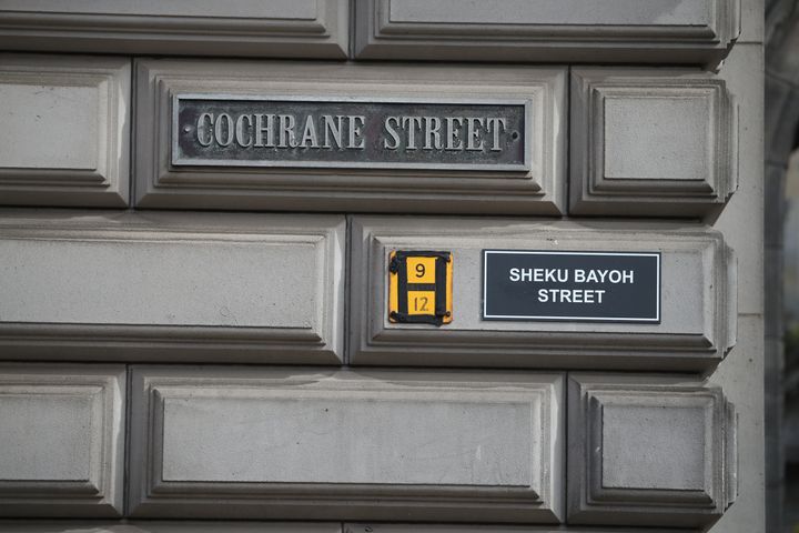 A sign alternatively naming Cochrane Street 'Sheku Bayoh Street' in Glasgow. 