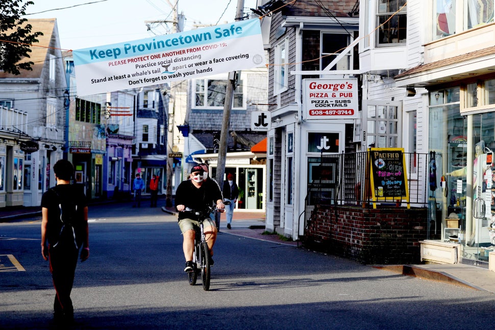 A biker rides down Commercial Street on May 25, 2020, in Provincetown. Massachusetts has now begun phase two of reopening aft